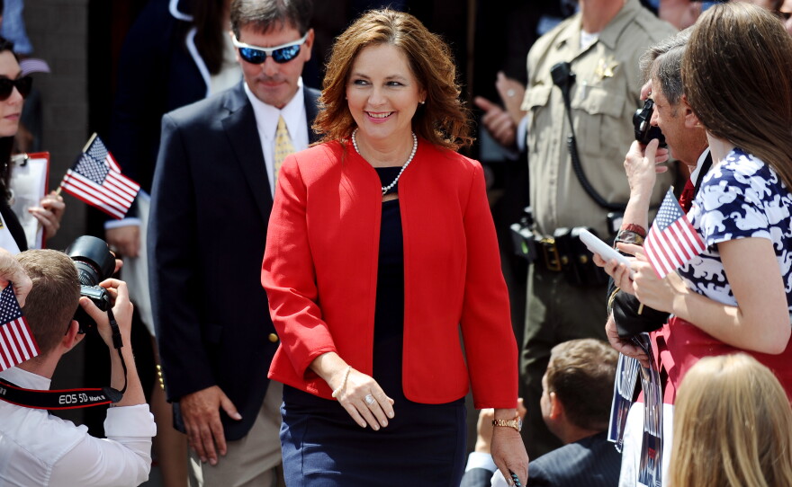 Darline Graham Nordone, sister of Sen. Lindsey Graham, walks to the stage before his announcement for the presidency in 2015 in Central, S.C.