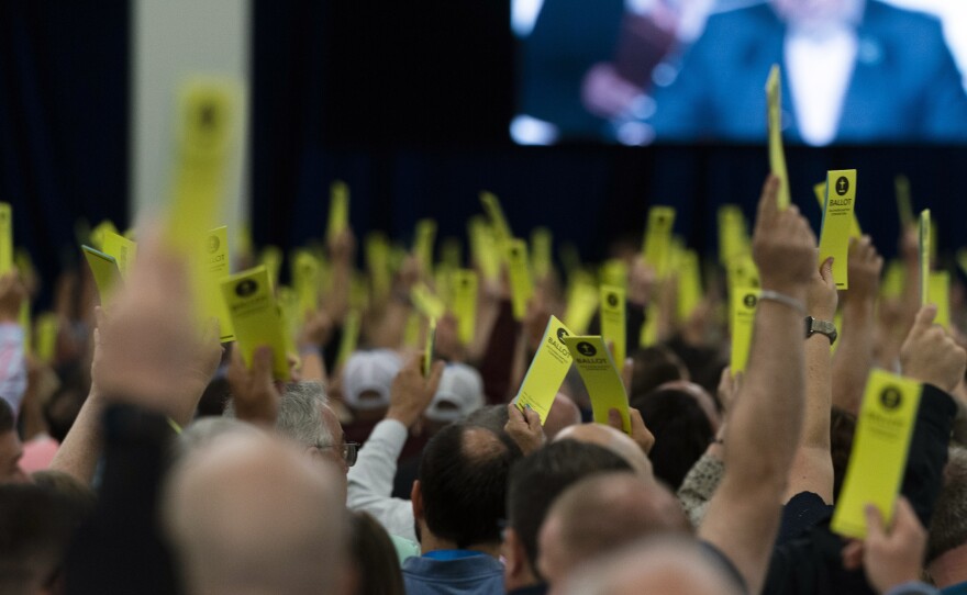 Attendees hold up their ballots during a session at the Southern Baptist Convention's annual meeting in Anaheim, Calif., Tuesday, June 14, 2022.