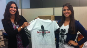 Joely Proudfit, Director of the California Indian Culture and Sovereignty Center at Cal State San Marcos, and Megan Doughty show off the t-shirts on sale at the second annual Native American Film Festival, Nov. 20, 2014.