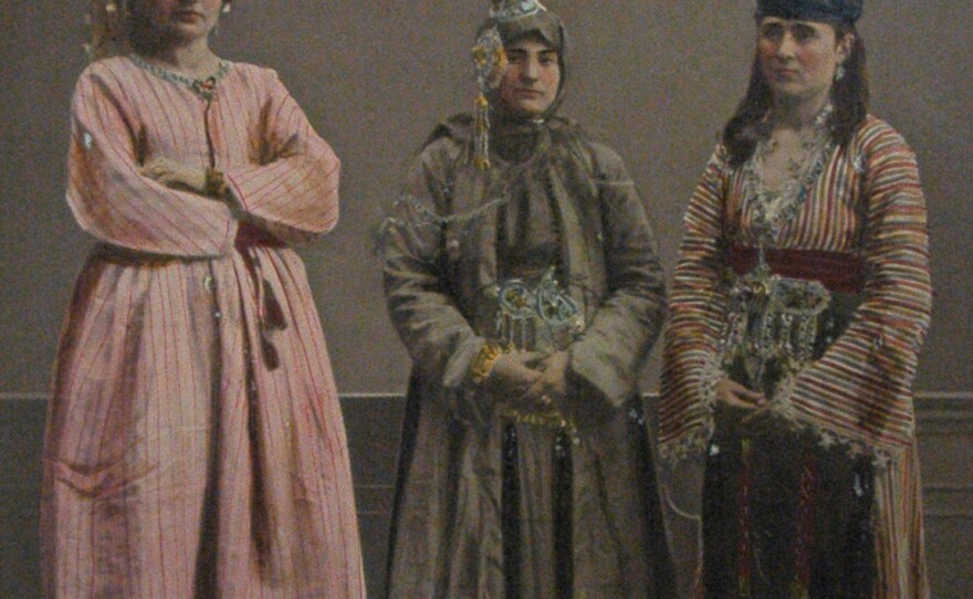 Photographs from a book published by the Ottoman Imperial Commission for the World's Fair in 1873 illustrate Syria's diverse cultures. Here, an Arab woman (left) and a Druze woman (center) stand with another woman; all are from Damascus.