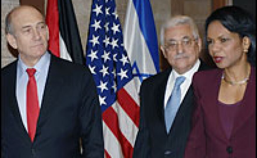 Israeli Prime Minister Ehud Olmert (from left), Secretary of State Condoleezza Rice and Palestinian President Mahmoud Abbas arrive for talks in Jerusalem.