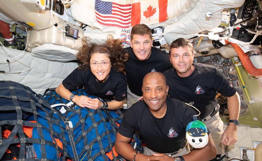 The Artemis II crew — Christina Koch (left), Jeremy Hansen, Victor Glover and Reid Wiseman — have to share tight quarters aboard the Orion spacecraft on their way home. But even with limited space, they can still get a solid workout in — thanks to a very special piece of equipment.