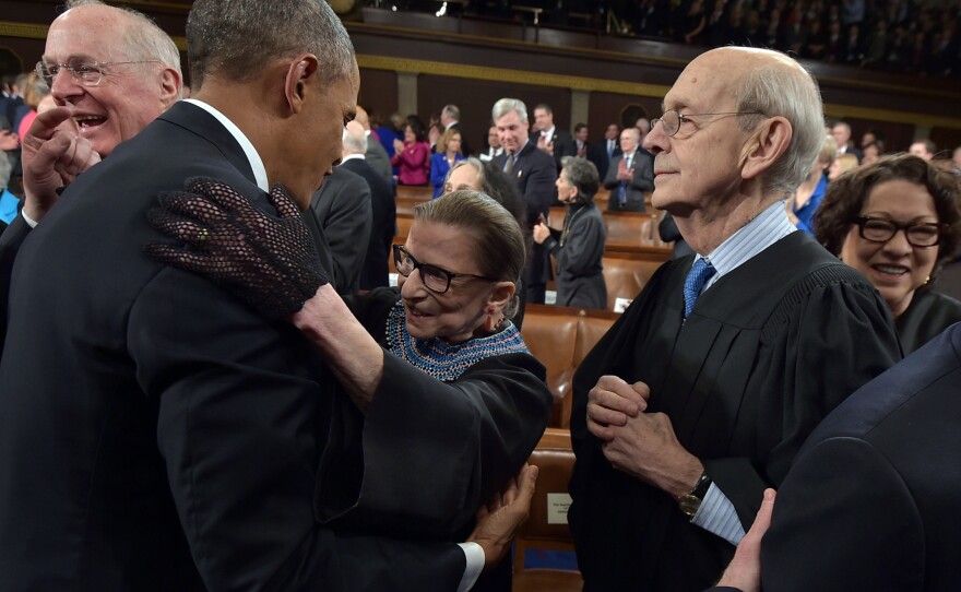 President Barack Obama embraces Supreme Court Justice Ruth Bader Ginsburg as Supreme Court Justices Anthony Kennedy (left), Stephen Breyer and Sonia Sotomayor look on before the president's State Of The Union address on Jan. 20, 2015.