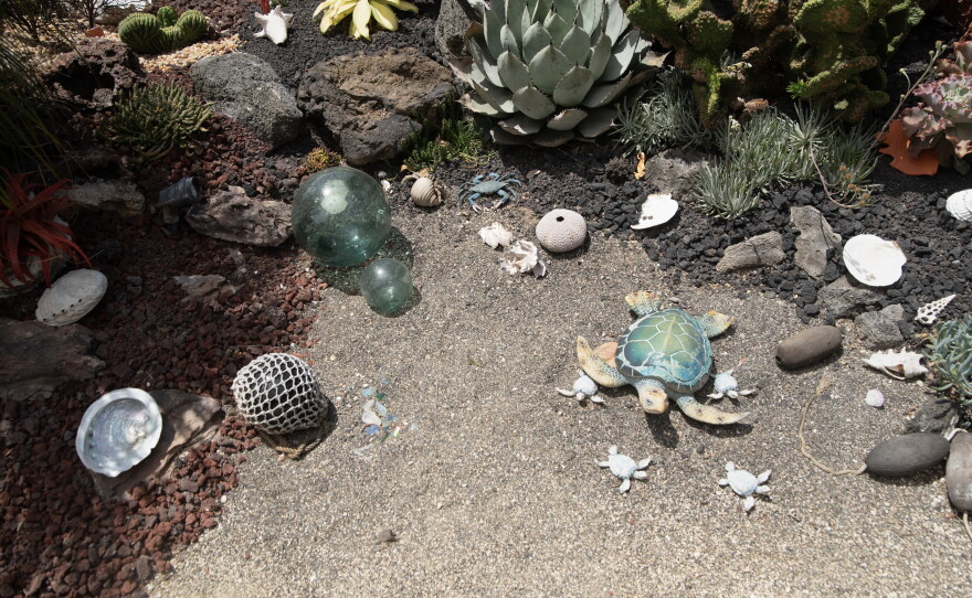 A ceramic turtle is shown, along with other sea-related objects in Carol Kent's Clairemont garden on May 28, 2026.