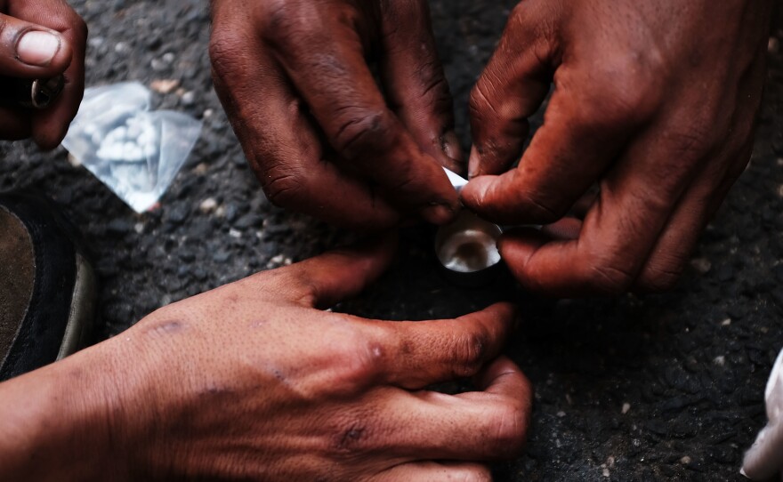 Heroin users prepare the drug in New York City's South Bronx neighborhood.