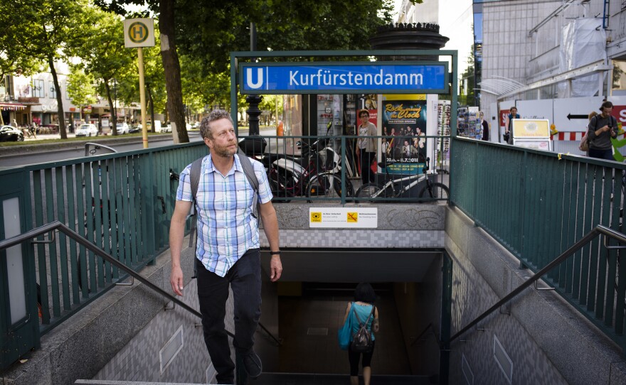 Uri Berliner emerges from the Berlin subway. He came to the city to research his father's and his grandparents' lives, and to finally see his dad's toy monkey for himself.
