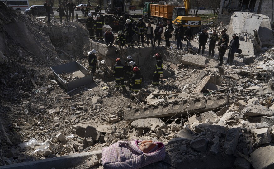 Rescuers search a collapsed building in Borodyanka.