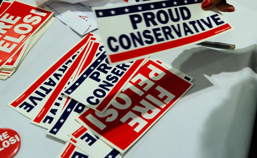 Democratic incumbents are in conservative voters' sights, as the buttons, stickers and T-shirts for sale at a Republican rally in Anaheim, Calif., earlier this month show.