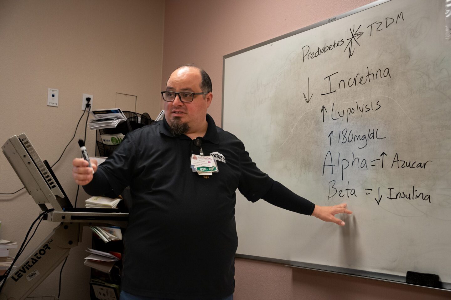 Stephen Jaime explains the basics of prediabetes and diabetes to a patient in his diabetes education class at El Centro Regional Medical Center's Calexico campus on July 15, 2024.