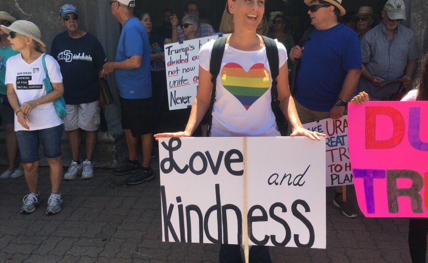 Nicole D’Angelo, a San Diego resident, holds a sign that reads "Love and kindness," Aug. 27, 2017.
