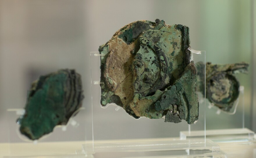 The three main fragments of the Antikythera Mechanism, Fragments A, B & C. These fragments contain all the known surviving gears, except for a single gear of unknown function in Fragment D. They are on display at the National Archaeological Museum in Athens.