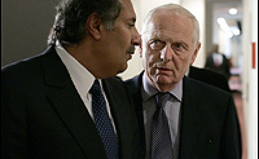 British Ambassador to the United Nations Emyr Jones Parry, right, speaks with Qatar's Foreign Minister, Sheikh Hamad bin Jassim Al-Thani.
