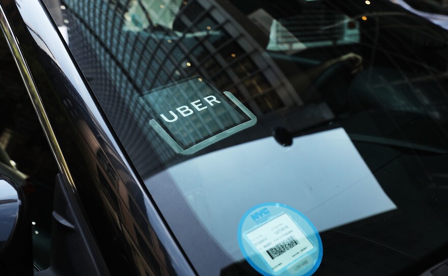 An Uber car waits for a client in Manhattan in June 2017. A study from MIT says most drivers are making less than minimum wage.