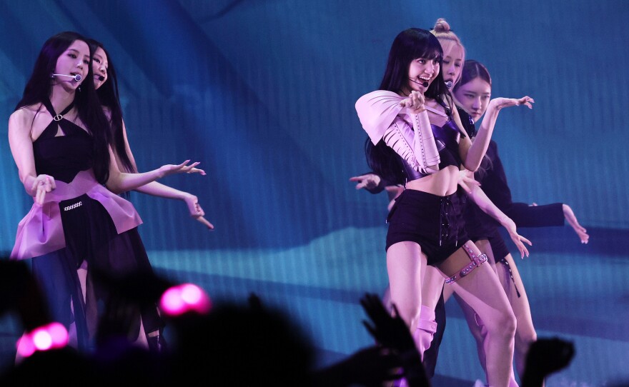 BLACKPINK, seen performing at the 2022 MTV VMAs, are now the most streamed female band on Spotify.