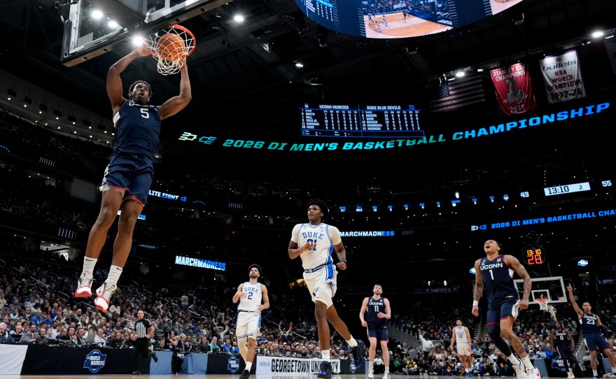 FILE - UConn forward Tarris Reed Jr. (5) dunks against Duke during the second half in the Elite Eight of the NCAA college basketball tournament on March 29, 2026, in Washington.