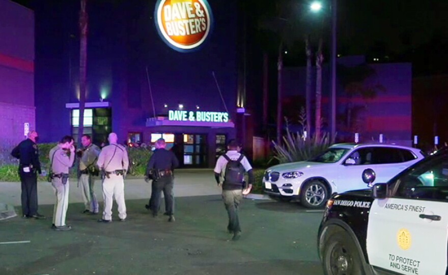 San Diego police and sheriff's deputies outside Dave & Buster's in Mission Valley following a fatal shooting June 17, 2021.