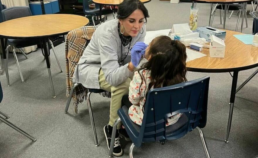 Healthy Communities Coalition executive director Wendy Madson says mobile dental clinics in Lyon County, Nevada, help reach young students whose parents might otherwise lack the means or insurance to schedule regular visits.