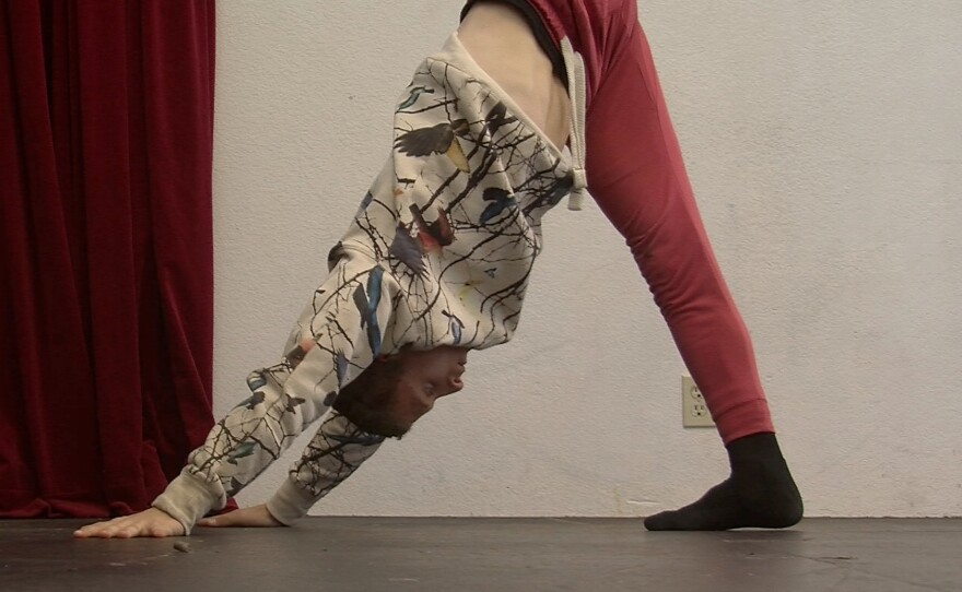 Seventeen-year-old dancer Dylan Hoffinger warms up for rehearsal at Diversionary Theatre.