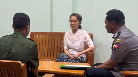 In this undated photo provided on April 30, 2026, by the Myanmar Military True News Information Team, the country's former leader Aung San Suu Kyi, center, talks with officials in an undisclosed location in Myanmar.