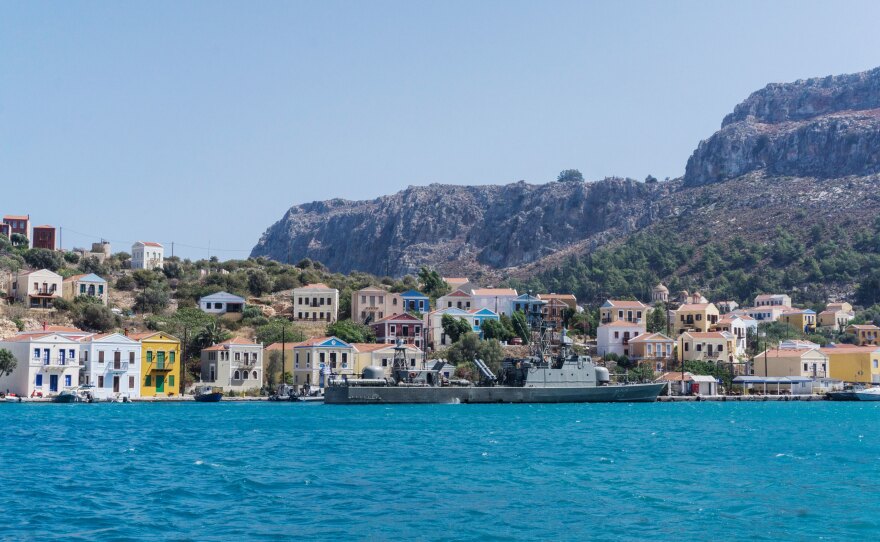 A Greek military ship is moored at the port of Kastellorizo.