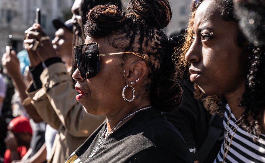 Attendees listen Dr. Kaba Kamene deliver his speech.