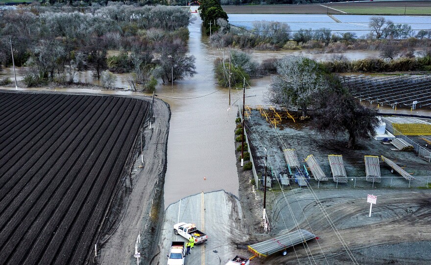 Floodwaters cover South Davis Road near Salinas in Monterey County, Calif., as the Salinas River overflows its banks on Jan. 13, 2023.