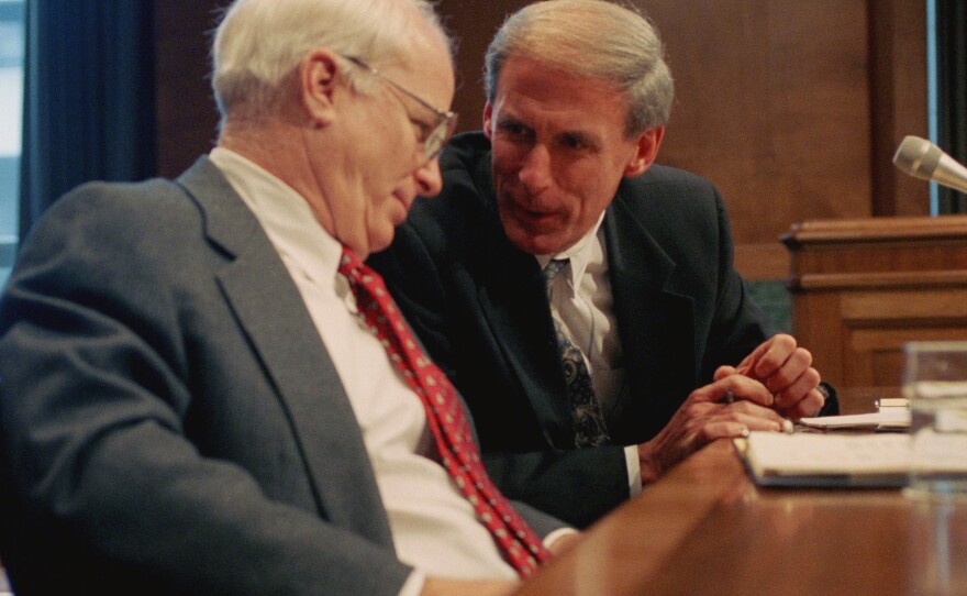 Sen. Dan Coats, right, talks with Sen. John S. McCain prior to testifying before a Senate Budget Committee hearing in 1995.