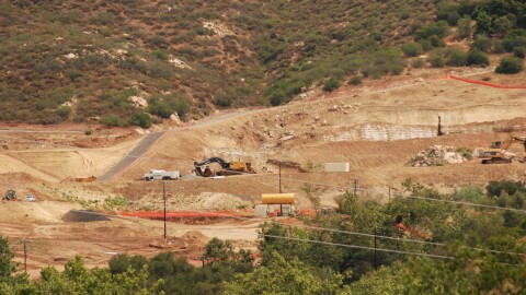 Construction vehicles are shown parked on the future site of the Hidden Valley Ranch housing development in Poway, California on April 22, 2026. The California Attorney General and San Pasqual Band of Mission Indians are suing Poway alleging environmental review violations involving the discovery of tribal remains.