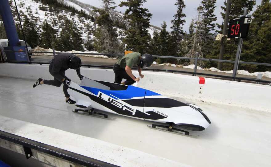 American bobsledders Justin Olsen and John Napier test BMW's two-man bobsled prototype in the Utah Olympic Park in 2012.