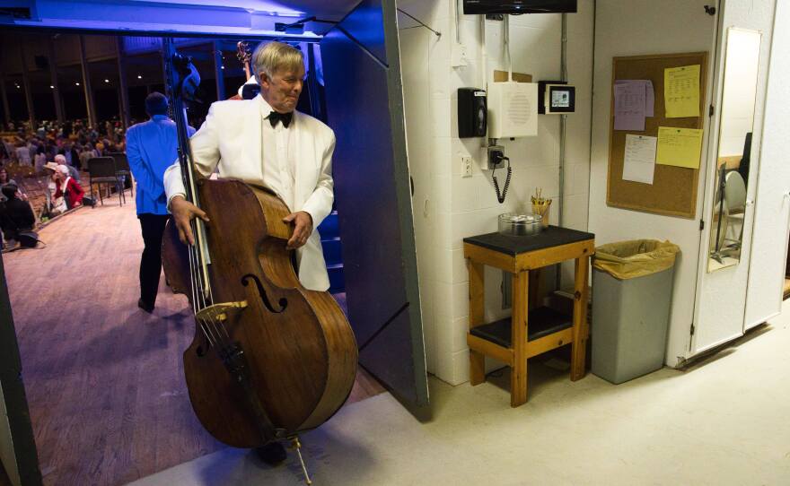Lawrence Wolfe, assistant principal bassist of the Boston Symphony Orchestra, leaves the stage during during the July 10 concert at Tanglewood.