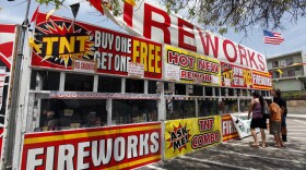 A family buys fireworks at a TNT Fireworks stand in the City of Monterey Park, Calif., on Tuesday, July 2, 2013.