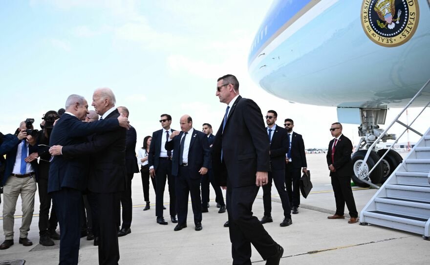 Israeli Prime Minister Benjamin Netanyahu hugs President Biden as he arrives in Tel Aviv on Oct. 18, 2023.