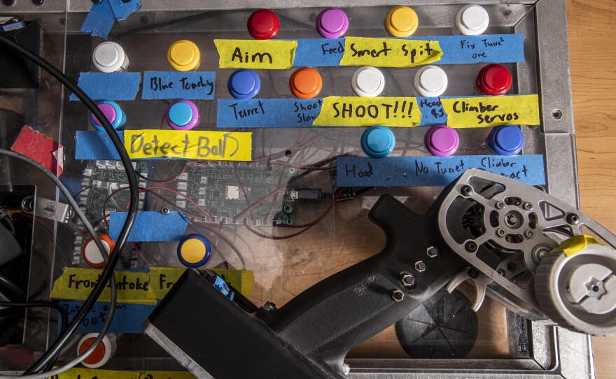 Spartan Robotics control board and pistol-grip controller from 2022, when robots had to catapult giant tennis balls into a basket and dangle from a chin-up bar.