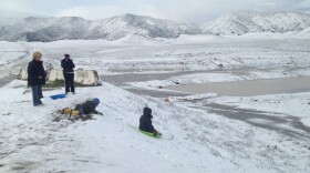 Children are shown sledding in Murrieta where snow covered parts of the city on Dec. 31, 2014. 
