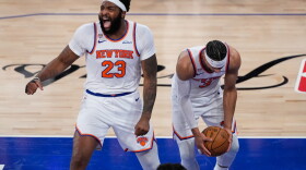 New York Knicks center Mitchell Robinson (23) and guard Josh Hart (3) celebrate after Game 4 of the NBA Finals basketball series against the San Antonio Spurs, Wednesday, June 10, 2026, in New York.
