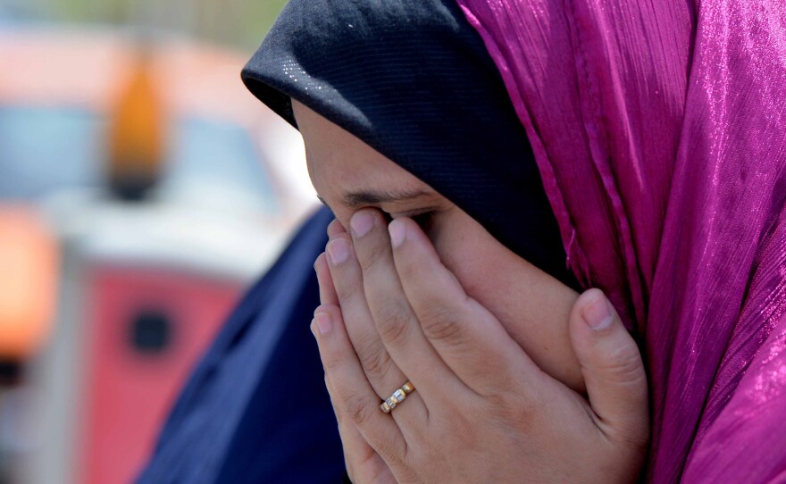 A relative of a passenger on EgyptAir Flight 804 cries at Cairo International Airport as she tries to get information about the plane's fate.