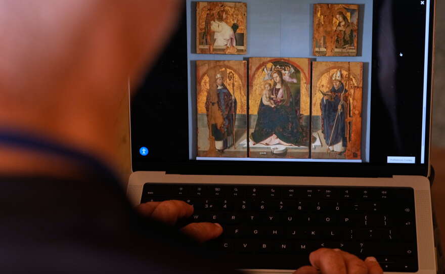 A journalist browses the Messina museum website showing a picture of the Early Renaissance painter Antonello da Messina's artwork, multiple pieces of which were stolen from the Sicilian museum on Aug. 15, 2026.