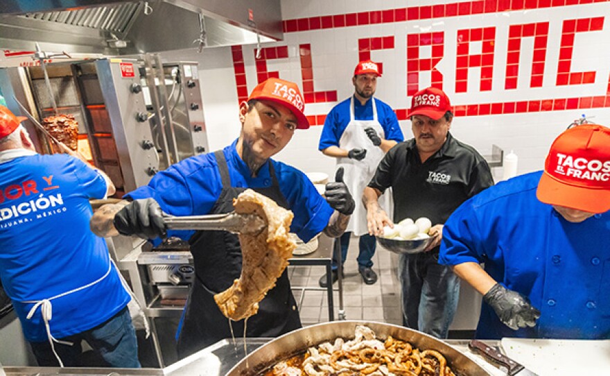 Cooks in the kitchen at Tacos El Franc