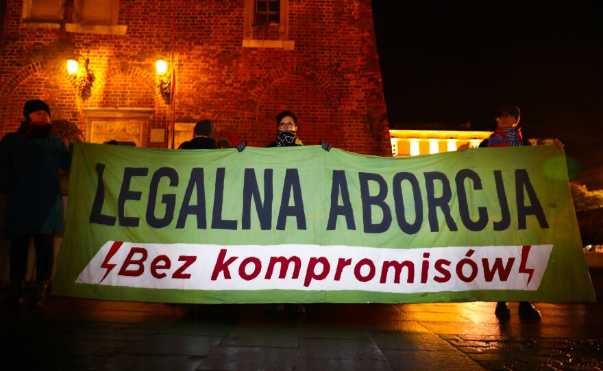 Demonstrators in Krakow, Poland, hold a banner reading "Legal Abortion Without Compromise" at a December 2021 protest. Poland has some of the most restrictive abortion laws in Europe.