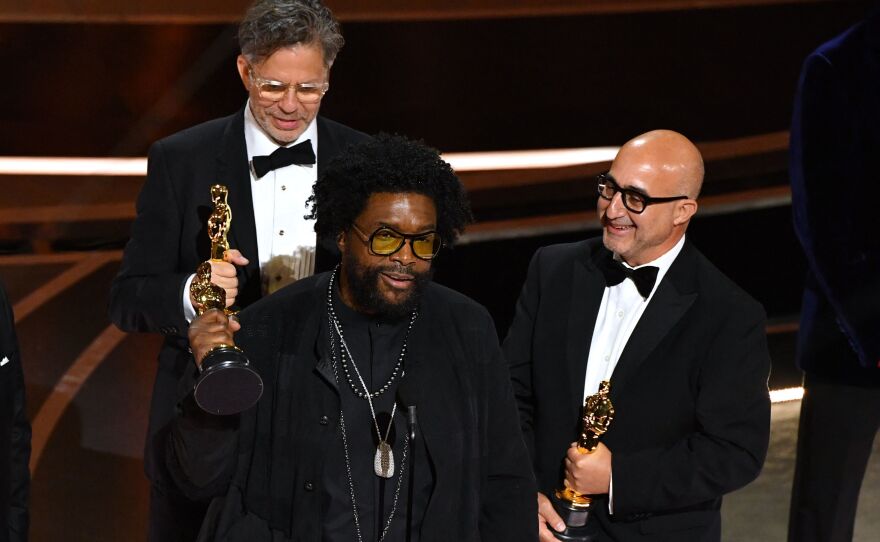 Ahmir "Questlove" Thompson (C), Robert Fyvolent (L) and David Dinerstein (R) accept the Oscar for best documentary feature for <em>Summer of Soul. </em>