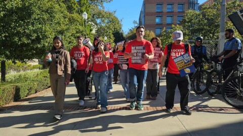 Dozens of UC students march outside a meeting of the University of California Board of Regents in Los Angeles to protest the system’s plan to continue annual tuition increases on Nov. 19, 2025.