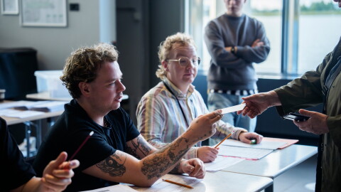 An election worker assists a voter at a polling station inside Reykjavik City Hall in Reykjavik, Iceland, Saturday, Aug. 29, 2026.