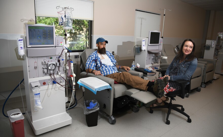 Sovereign Valentine and his wife, Jessica, wait as a dialysis machine filters his blood. Before finding a dialysis clinic in their insurance network, the Valentines were charged more than a half-million dollars for 14 weeks of treatment.