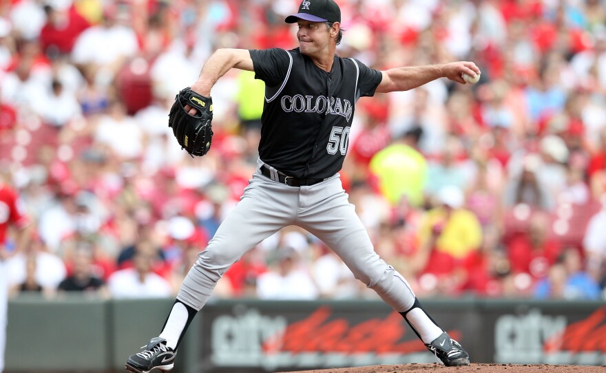 Jamie Moyer, shown above pitching for the Colorado Rockies in May 2012, made his major league debut back in 1986. He says that after decades in the major leagues, he'd occasionally have to remind himself that "in baseball terms, I really was old, but in everyday life, I really wasn't."