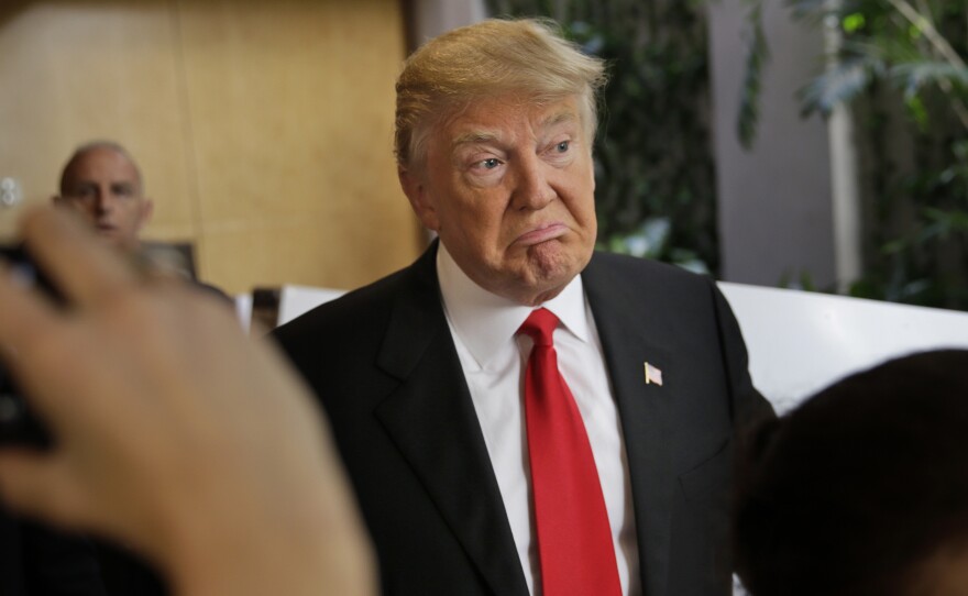 Donald Trump talks to reporters just before casting his ballot in New York Tuesday. With more big wins, Trump could be on his way to the GOP nomination.