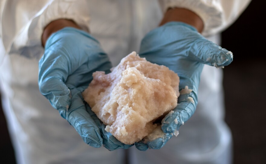 A drug specialist in the Mexican army shows crystal methamphetamine paste seized at a clandestine laboratory in Mexico's Baja California in August. Much of the meth sold in the U.S. today comes from Mexico, according to DEA officials.