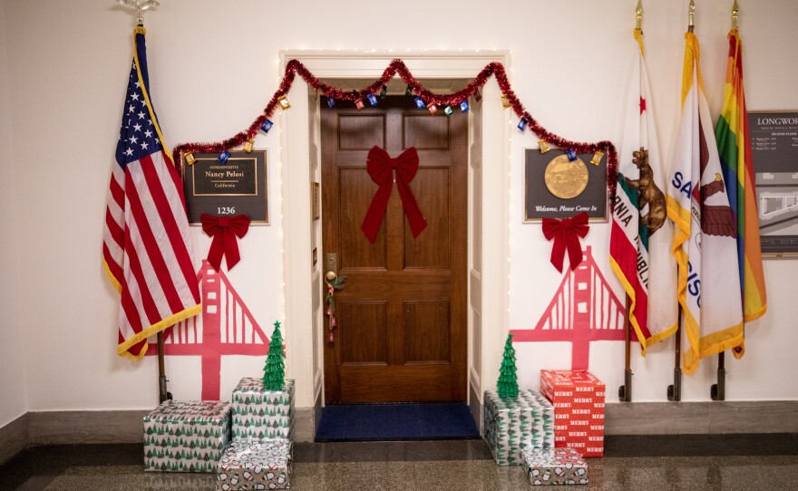 House Speaker Nancy Pelosi's office is decorated for the holidays and has a paper golden gate bridge on either side of the door.