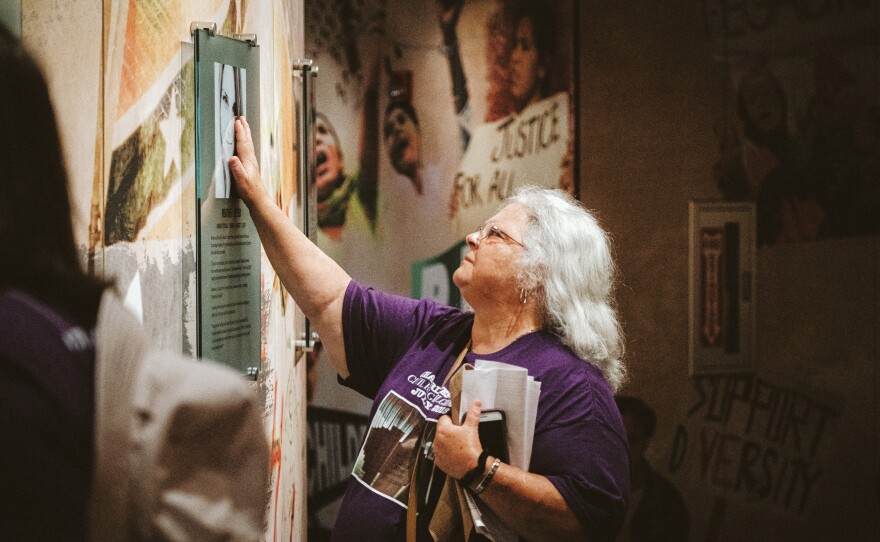Heather Heyer's mom, Susan Bro, has a moment with a commemoration of her daughter at the Civil Rights Memorial Center in Montgomery, Ala.