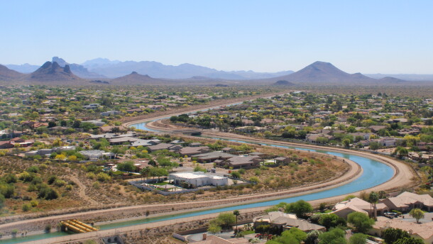 The Central Arizona Project canal winds through Phoenix on March 26, 2026. The 336-mile canal system pumps water from the Colorado River to the Phoenix and Tucson areas. Water supplies for the canal's users will be cut under a new plan for managing the Colorado River.