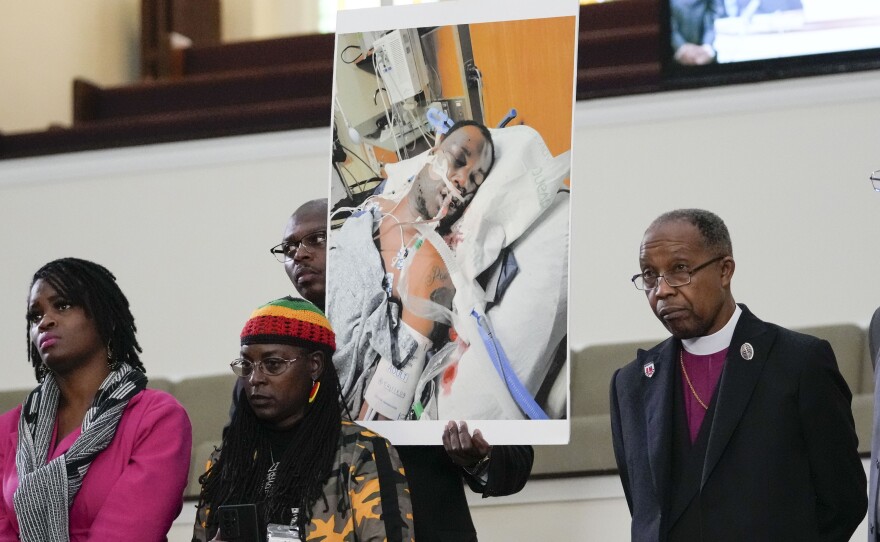 Family members and supporters hold a photograph of Tyre Nichols at a news conference in Memphis, Tenn., earlier this week.